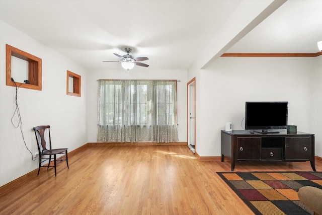 7050 26th Pkwy, Berwyn, IL 60402 - living area with wood finished floors, a ceiling fan, and baseboards