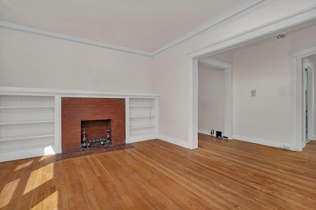 2749 N Hampden Ct Unit 1E, Chicago, IL 60614 - unfurnished living room with wood finished floors, a fireplace, built in features, baseboards, and crown molding