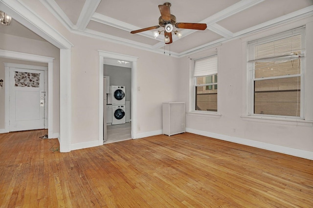 2749 N Hampden Ct Unit 1E, Chicago, IL 60614 - empty room with estacked washer and dryer, coffered ceiling, light wood finished floors, ceiling fan, and baseboards