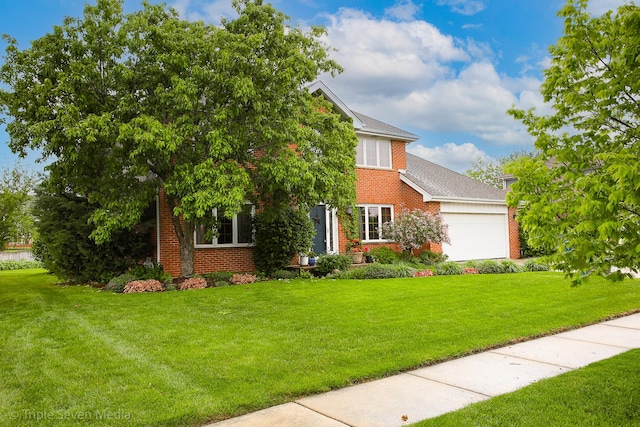 14822 S Eagle Ridge Dr, Homer Glen, IL 60491 - colonial-style house with brick siding, a front yard, and a garage