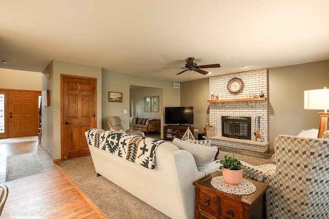 14822 S Eagle Ridge Dr, Homer Glen, IL 60491 - living area with ceiling fan, light wood-type flooring, a brick fireplace, and baseboards