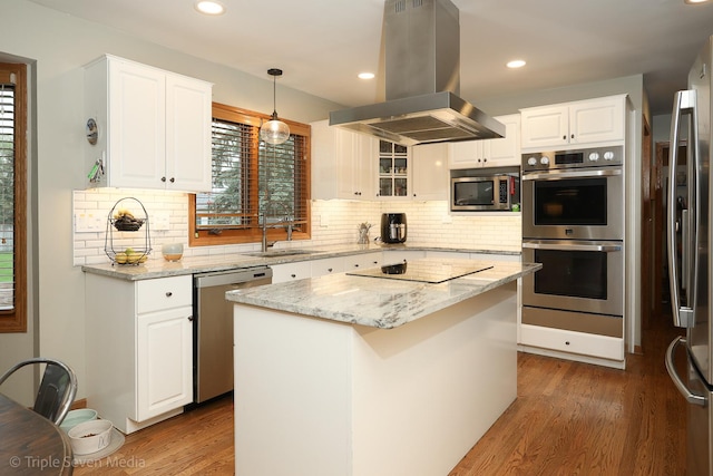 14822 S Eagle Ridge Dr, Homer Glen, IL 60491 - kitchen with appliances with stainless steel finishes, island exhaust hood, a sink, wood finished floors, and white cabinets