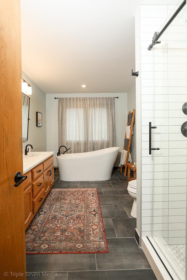 14822 S Eagle Ridge Dr, Homer Glen, IL 60491 - bathroom featuring vanity, a stall shower, recessed lighting, toilet, and a soaking tub