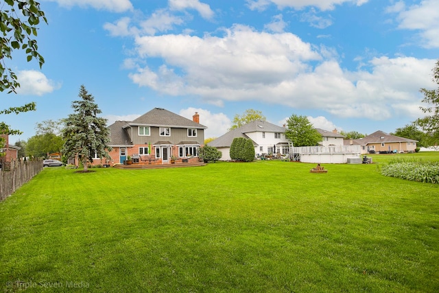 14822 S Eagle Ridge Dr, Homer Glen, IL 60491 - back of house featuring a wooden deck, a chimney, and brick siding