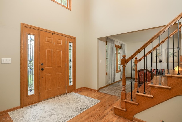 14822 S Eagle Ridge Dr, Homer Glen, IL 60491 - entrance foyer featuring stairs, wood finished floors, baseboards, and a high ceiling