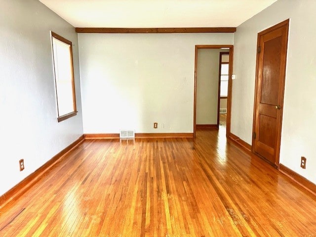 913 Academy St, Dixon, IL 61021 - spare room featuring hardwood / wood-style flooring and baseboards