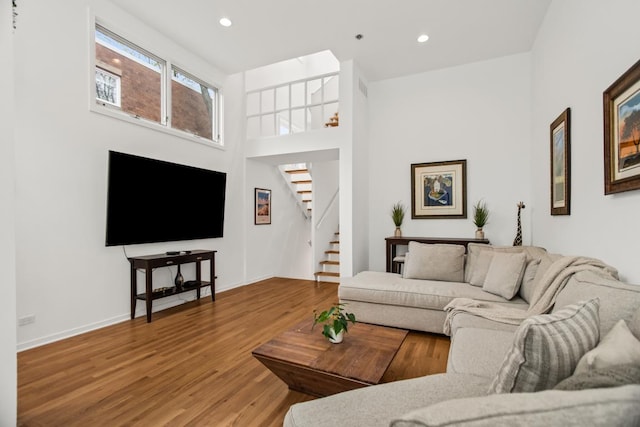 1203 Central St Unit C, Evanston, IL 60201 - living area with stairway, wood finished floors, recessed lighting, and baseboards