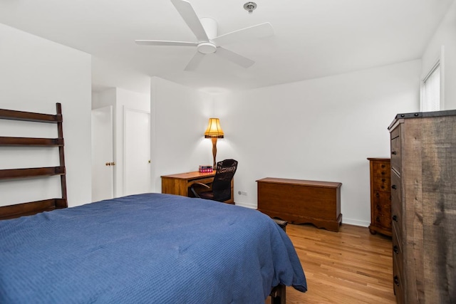 1203 Central St Unit C, Evanston, IL 60201 - bedroom with wood finished floors, ceiling fan, and baseboards