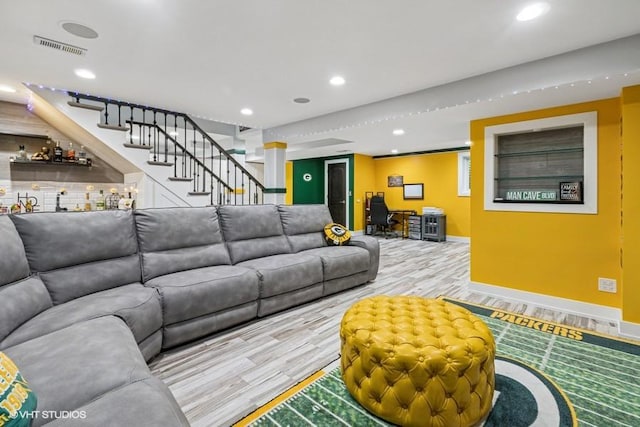 7146 S Oketo Ave, Bridgeview, IL 60455 - living room featuring wood finished floors, a bar, baseboards, stairway, and recessed lighting