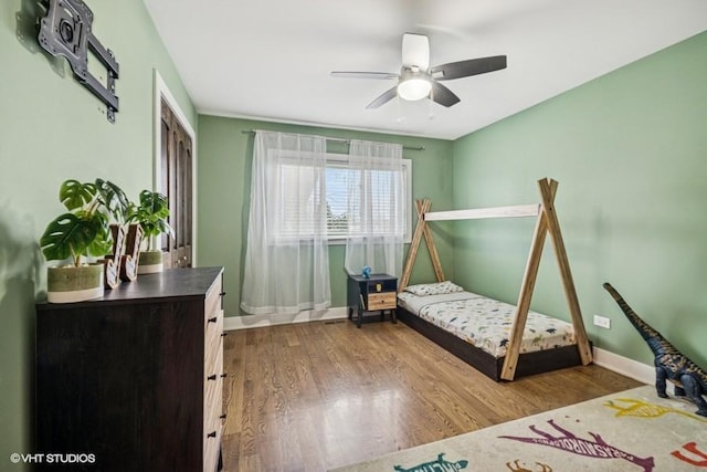 7146 S Oketo Ave, Bridgeview, IL 60455 - bedroom featuring baseboards, wood finished floors, and a ceiling fan