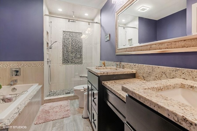 7146 S Oketo Ave, Bridgeview, IL 60455 - bathroom featuring a stall shower, toilet, two vanities, a garden tub, and recessed lighting