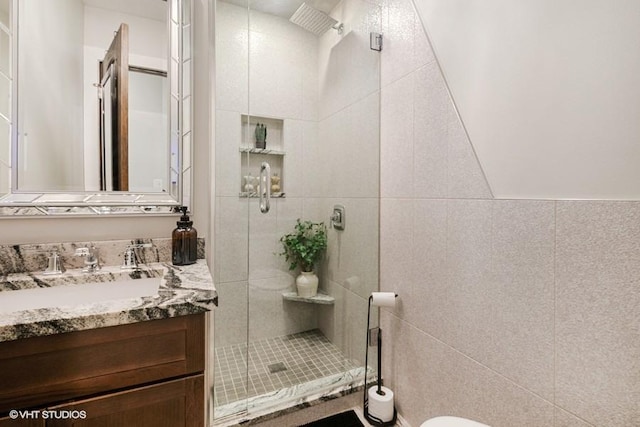 7146 S Oketo Ave, Bridgeview, IL 60455 - full bathroom with vanity, a stall shower, toilet, and tile walls