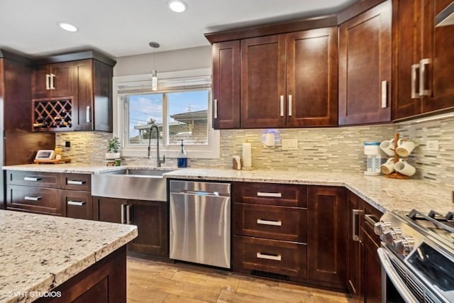 7146 S Oketo Ave, Bridgeview, IL 60455 - kitchen featuring appliances with stainless steel finishes, a sink, light stone counters, backsplash, and recessed lighting