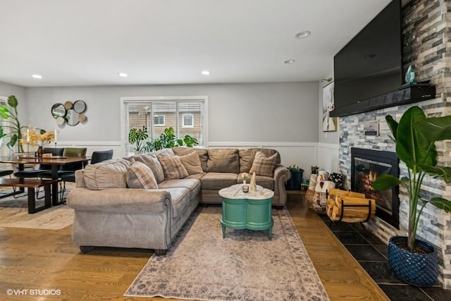 7146 S Oketo Ave, Bridgeview, IL 60455 - living area featuring wood finished floors, a wainscoted wall, recessed lighting, and a large fireplace