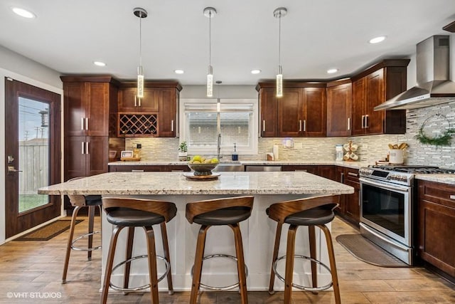 7146 S Oketo Ave, Bridgeview, IL 60455 - kitchen with wall chimney range hood, stainless steel gas range, light wood-type flooring, a sink, and recessed lighting