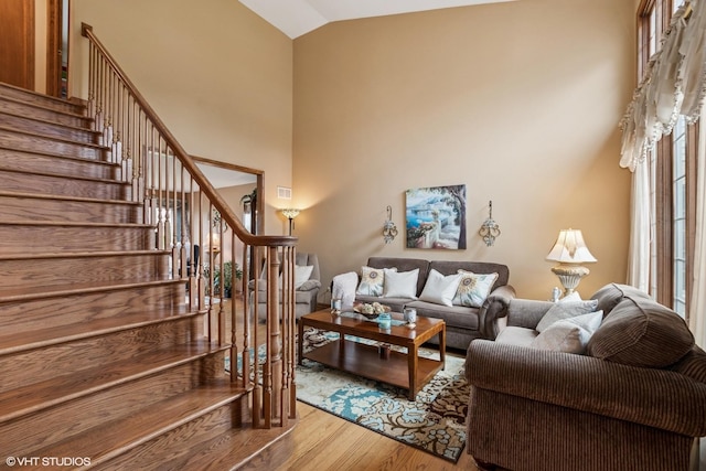 8806 175th St, Tinley Park, IL 60487 - living area with wood finished floors, stairs, and high vaulted ceiling