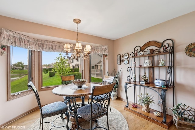 8806 175th St, Tinley Park, IL 60487 - dining room featuring a chandelier, light wood-type flooring, and baseboards