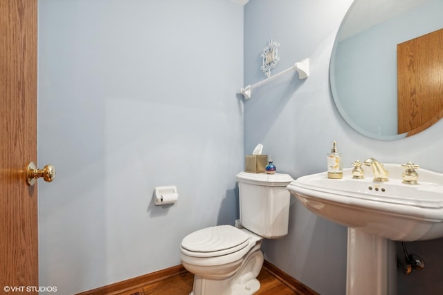 8806 175th St, Tinley Park, IL 60487 - half bathroom with toilet, baseboards, and wood finished floors