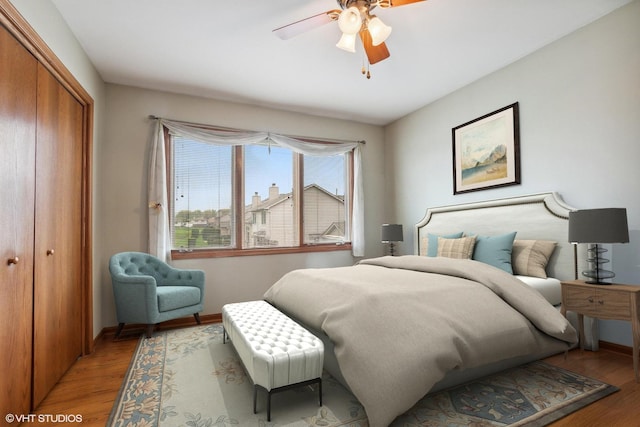 8806 175th St, Tinley Park, IL 60487 - bedroom featuring light wood-type flooring, a closet, baseboards, and ceiling fan