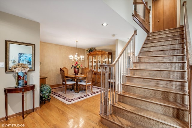 8806 175th St, Tinley Park, IL 60487 - staircase with wood finished floors, a chandelier, baseboards, and recessed lighting