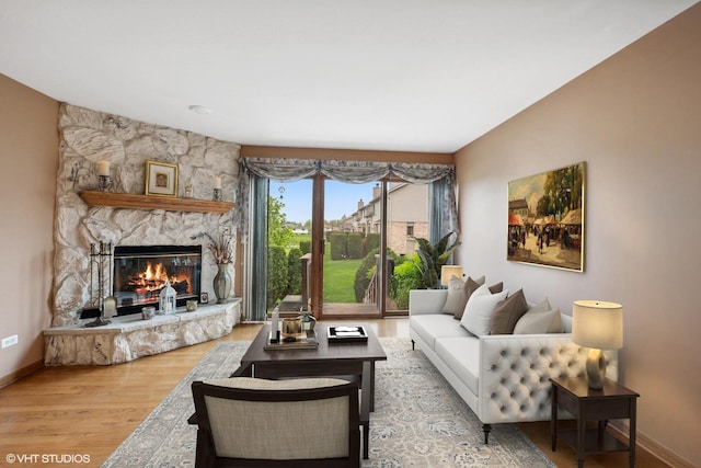 8806 175th St, Tinley Park, IL 60487 - living area with wood finished floors, a fireplace, and baseboards