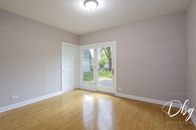 36509 N Traer Ter, Gurnee, IL 60031 - spare room with baseboards and wood finished floors
