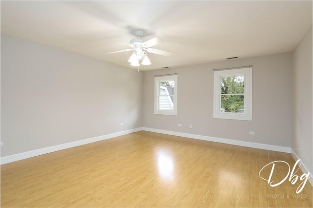 36509 N Traer Ter, Gurnee, IL 60031 - empty room with baseboards, wood finished floors, and ceiling fan