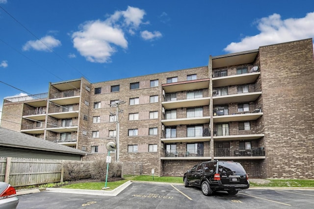 1433 Perry St Unit 305, Des Plaines, IL 60016 - view of apartment building / complex featuring uncovered parking