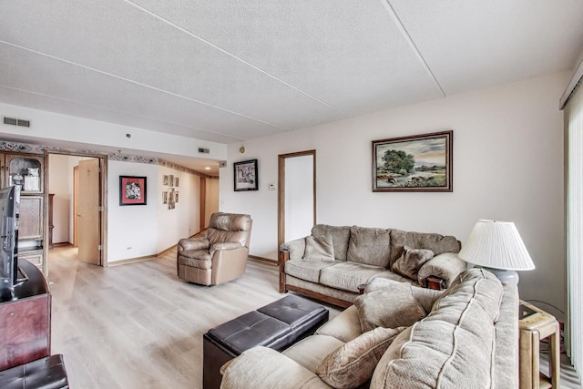 1433 Perry St Unit 305, Des Plaines, IL 60016 - living room with light wood-style flooring, baseboards, and a textured ceiling