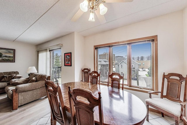 1433 Perry St Unit 305, Des Plaines, IL 60016 - dining area with ceiling fan, a textured ceiling, and light tile patterned floors