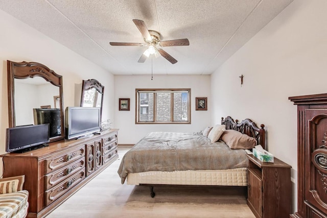 1433 Perry St Unit 305, Des Plaines, IL 60016 - bedroom featuring wood finished floors, a textured ceiling, and ceiling fan