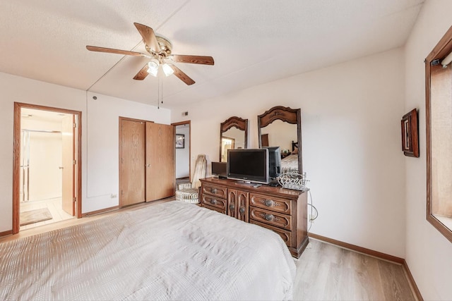 1433 Perry St Unit 305, Des Plaines, IL 60016 - bedroom with light wood-style floors, baseboards, ensuite bathroom, and a ceiling fan