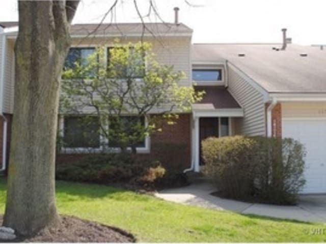 143 W Fabish Dr Unit 143, Buffalo Grove, IL 60089 - view of front of home with a garage