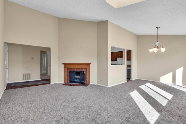 143 W Fabish Dr Unit 143, Buffalo Grove, IL 60089 - unfurnished living room featuring high vaulted ceiling, a chandelier, carpet floors, a tiled fireplace, and a textured ceiling
