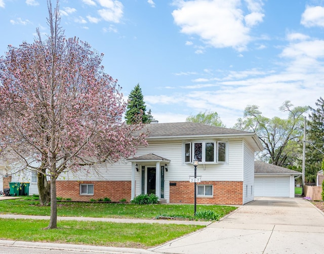 207 Muehl Dr, Lockport, IL 60441 - raised ranch with brick siding, a front lawn, and a detached garage