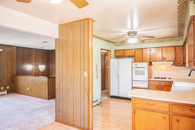 207 Muehl Dr, Lockport, IL 60441 - kitchen featuring a ceiling fan, white appliances, a sink, a warming drawer, and wood walls
