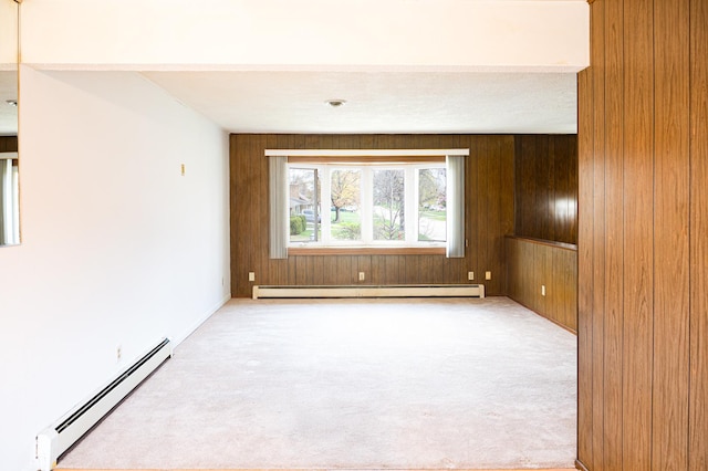 207 Muehl Dr, Lockport, IL 60441 - carpeted empty room with a baseboard radiator and wood walls