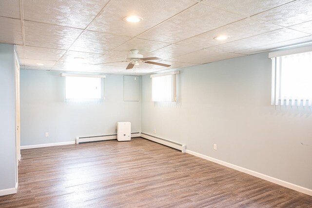 207 Muehl Dr, Lockport, IL 60441 - basement featuring wood finished floors, baseboards, a baseboard heating unit, ceiling fan, and recessed lighting
