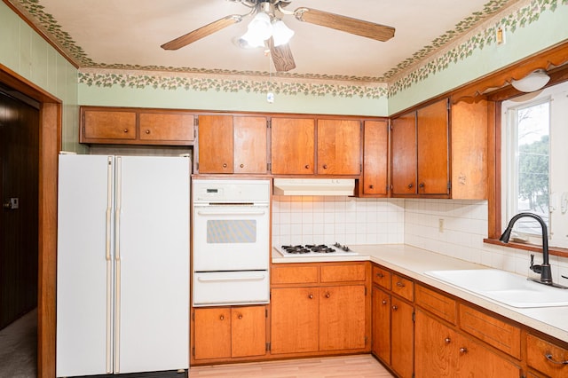 207 Muehl Dr, Lockport, IL 60441 - kitchen with white appliances, a warming drawer, a sink, under cabinet range hood, and ceiling fan
