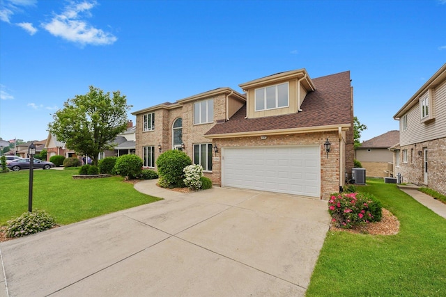 traditional-style house featuring brick siding, driveway, a front yard, and an attached garage