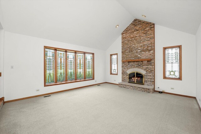 unfurnished living room featuring carpet, a chandelier, and high vaulted ceiling