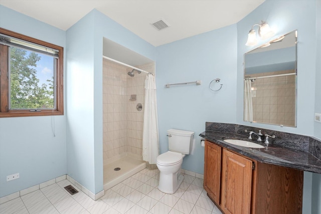 bathroom featuring vanity and tiled shower