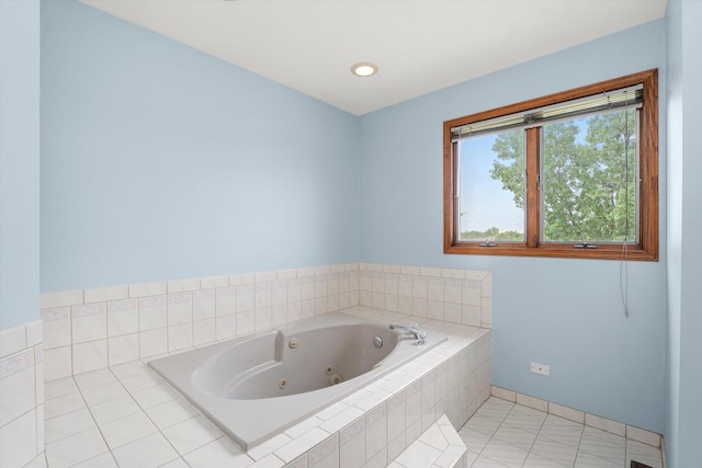 full bathroom featuring a jetted tub and tile patterned flooring