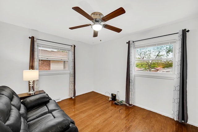 805 Highland Ave, Thornton, IL 60476 - living area with a ceiling fan, wood finished floors, and baseboards
