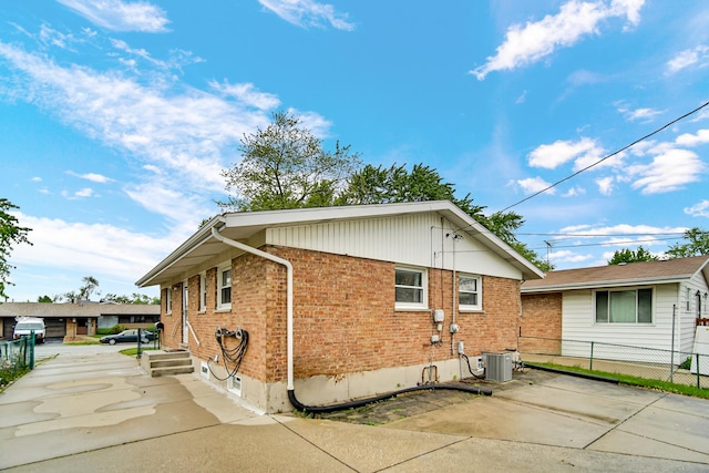 805 Highland Ave, Thornton, IL 60476 - back of house featuring central air condition unit and brick siding