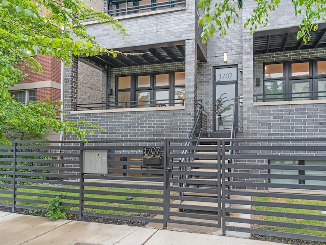 1707 S Jefferson St Unit 1, Chicago, IL 60616 - view of exterior entry featuring brick siding