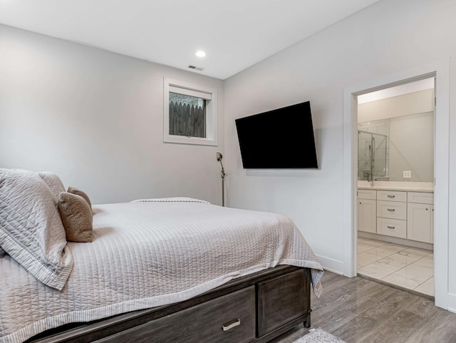 1707 S Jefferson St Unit 1, Chicago, IL 60616 - bedroom featuring baseboards, connected bathroom, recessed lighting, and light marble finish flooring