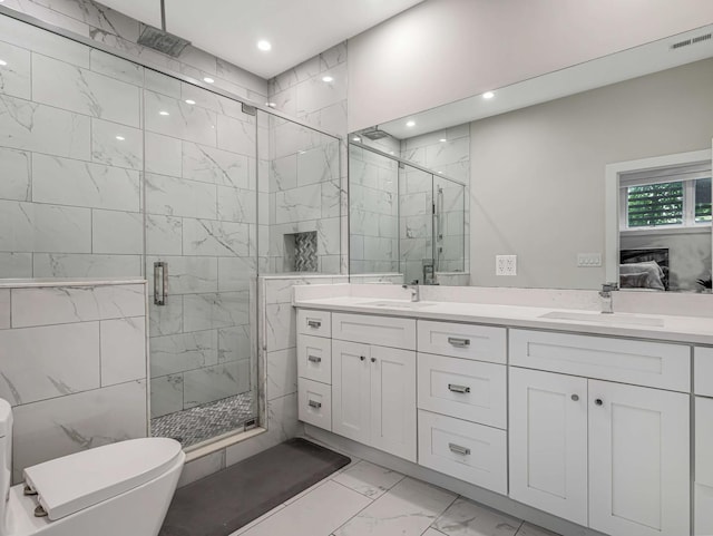 1707 S Jefferson St Unit 1, Chicago, IL 60616 - ensuite bathroom with marble look tile flooring, a marble finish shower, double vanity, toilet, and recessed lighting
