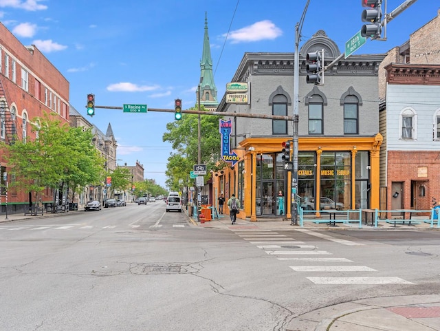 1707 S Jefferson St Unit 1, Chicago, IL 60616 - view of asphalt road featuring traffic lights, sidewalks, and curbs