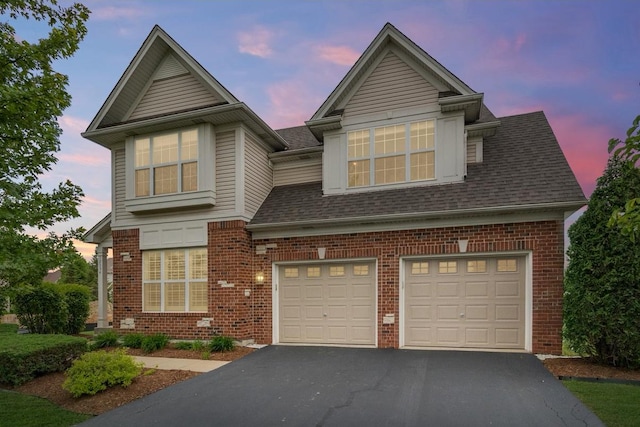 12354 S Blue Water Pkwy, Plainfield, IL 60585 - traditional home featuring brick siding, asphalt driveway, a shingled roof, and an attached garage